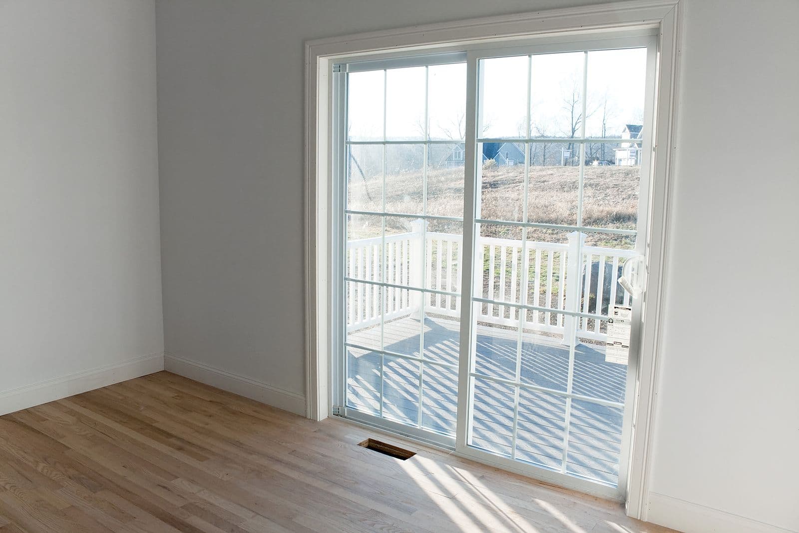 Sliding glass patio doors lead out to a deck.