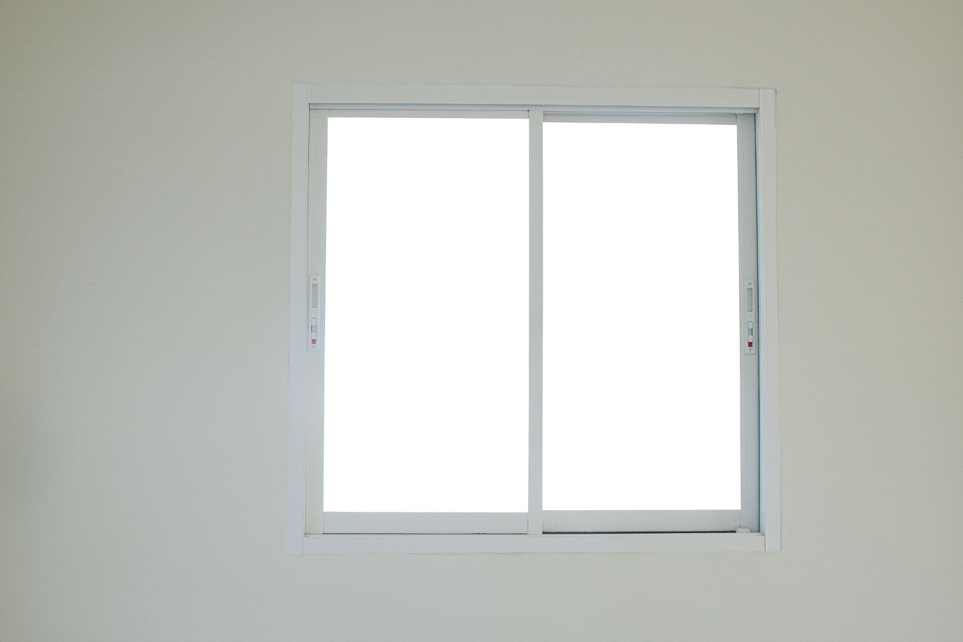 A Modern 2-Lite Sliding Window On a White Wall.